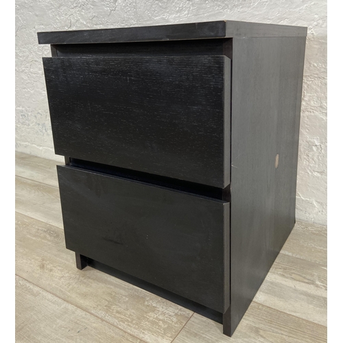 75 - An IKEA black laminate bedside chest of drawers - approx. 55cm high x 40cm wide x 49cm deep