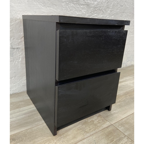 75 - An IKEA black laminate bedside chest of drawers - approx. 55cm high x 40cm wide x 49cm deep