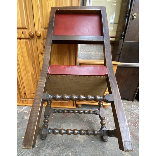 78 - A Victorian oak wind out extending dining table and eleven Cromwellian style oak and red vinyl chair... 