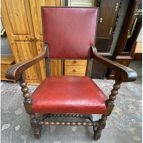 78 - A Victorian oak wind out extending dining table and eleven Cromwellian style oak and red vinyl chair... 