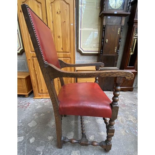 78 - A Victorian oak wind out extending dining table and eleven Cromwellian style oak and red vinyl chair... 