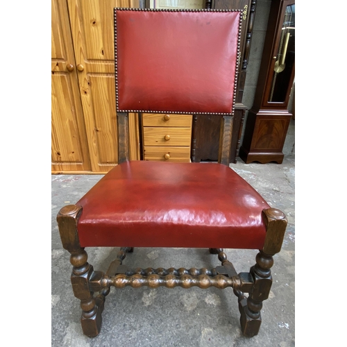 78 - A Victorian oak wind out extending dining table and eleven Cromwellian style oak and red vinyl chair... 