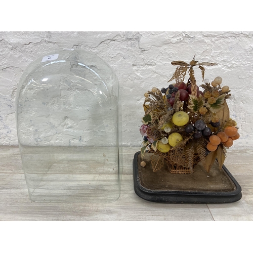 82 - A Victorian wax fruit display under glass dome on ebonised stand - approx. 43cm high x 29cm wide x 2... 