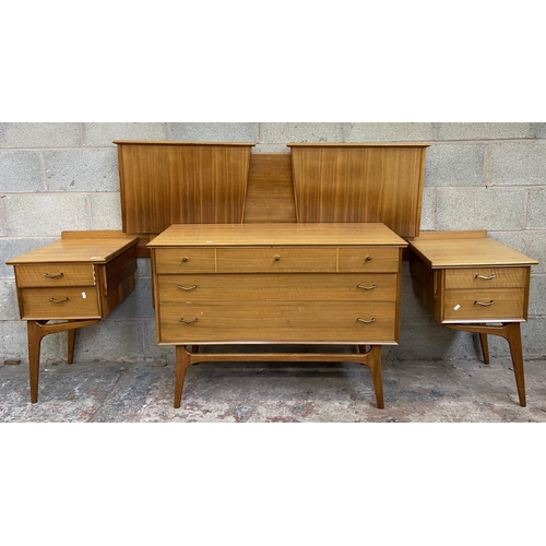 27 - An Alfred Cox walnut two piece bedroom suite comprising chest of drawers and headboard with fitted t... 