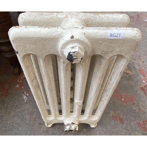 84 - A white painted cast iron radiator - approx. 47cm high x 150cm wide x 22cm deep