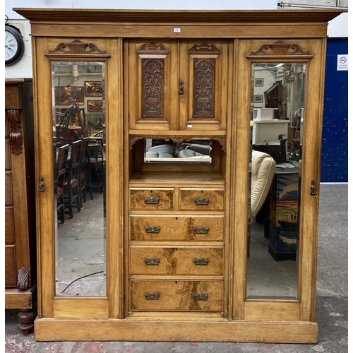 85 - A Victorian ash and carved walnut compactum wardrobe - approx. 206cm high x 193cm wide x 59cm deep