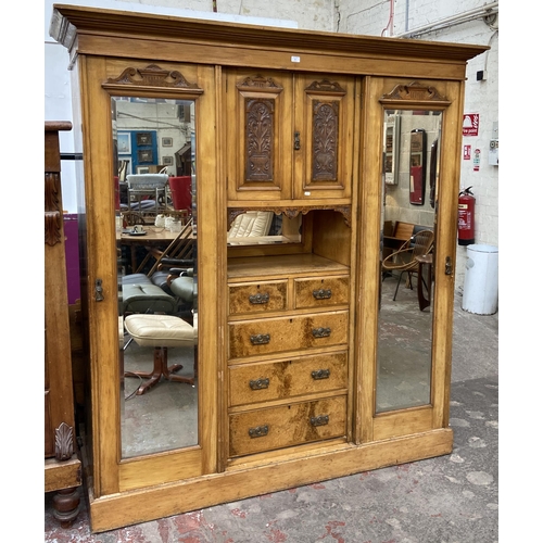 85 - A Victorian ash and carved walnut compactum wardrobe - approx. 206cm high x 193cm wide x 59cm deep