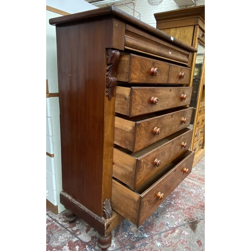 86 - A Victorian mahogany chest of drawers on turned supports with carved acanthus leaf design - approx. ... 