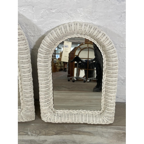 31 - Three white painted wicker framed wall mirrors - largest approx. 73cm high x 50cm wide