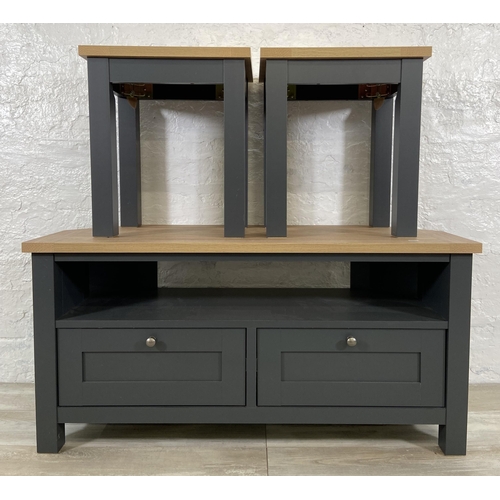 34 - Three pieces of Next Malvern slate grey and oak effect furniture, two side tables - approx. 49cm hig... 