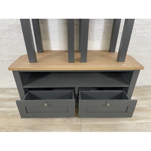 34 - Three pieces of Next Malvern slate grey and oak effect furniture, two side tables - approx. 49cm hig... 