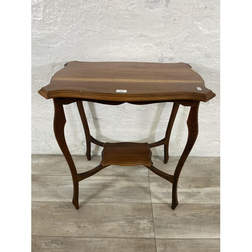 90 - An Edwardian walnut serpentine two tier side table - approx. 73cm high x 66cm wide x 43cm deep