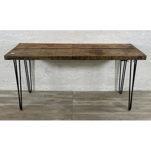 36 - An Industrial style pine desk on black tubular metal hairpin supports - approx. 76cm high x 156cm wi... 