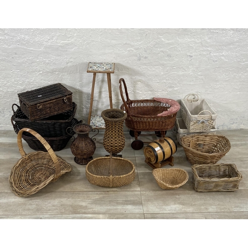 91 - A collection of wicker baskets and vases together with a bamboo plant stand with ceramic tile insert... 