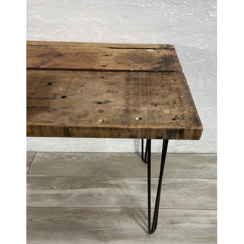 36 - An Industrial style pine desk on black tubular metal hairpin supports - approx. 76cm high x 156cm wi... 