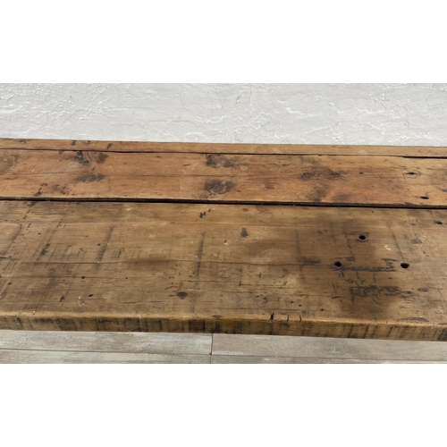 36 - An Industrial style pine desk on black tubular metal hairpin supports - approx. 76cm high x 156cm wi... 