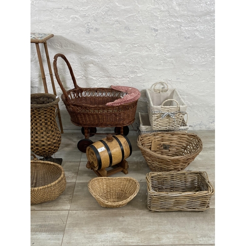 91 - A collection of wicker baskets and vases together with a bamboo plant stand with ceramic tile insert... 