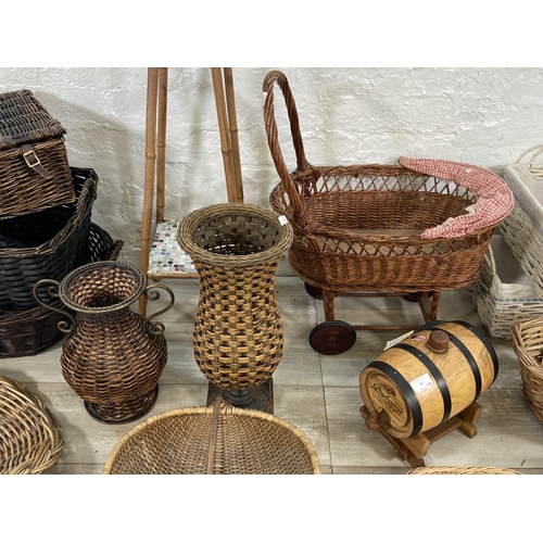 91 - A collection of wicker baskets and vases together with a bamboo plant stand with ceramic tile insert... 