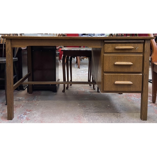 92 - A mid 20th century oak office desk - approx. 71cm high x 122cm wide x 68cm deep