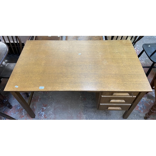 92 - A mid 20th century oak office desk - approx. 71cm high x 122cm wide x 68cm deep