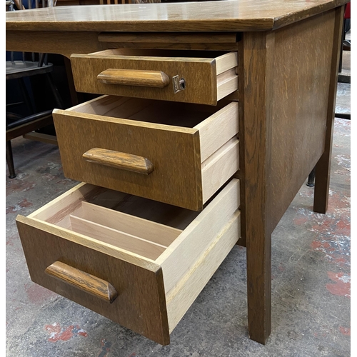 92 - A mid 20th century oak office desk - approx. 71cm high x 122cm wide x 68cm deep