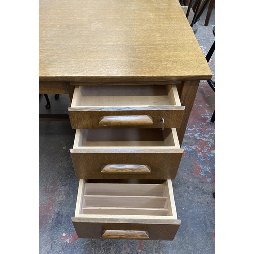 92 - A mid 20th century oak office desk - approx. 71cm high x 122cm wide x 68cm deep