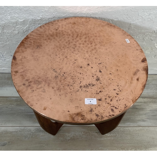 4 - A mid 20th century teak and copper topped circular side table - approx. 53cm high x 54cm diameter