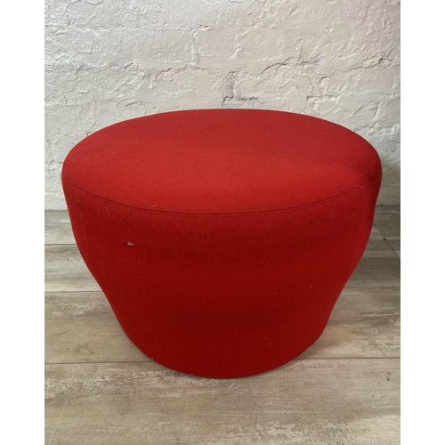 40 - Two pieces of modern red fabric upholstered furniture, one swivel armchair and one Orangebox circula... 