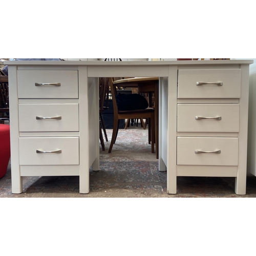 41 - A modern white painted oak dressing table - approx. 75cm high x 135cm wide x 43cm deep