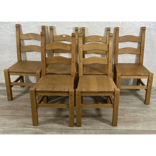 98 - Six beech ladder back dining chairs