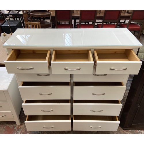 44 - A modern white painted oak chest of drawers - approx. 128cm high x 128cm wide x 43cm deep