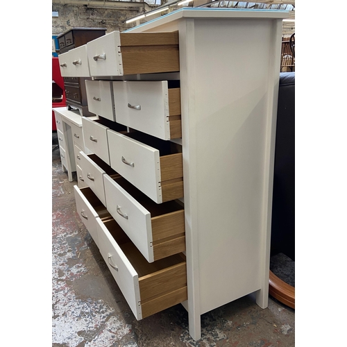 44 - A modern white painted oak chest of drawers - approx. 128cm high x 128cm wide x 43cm deep