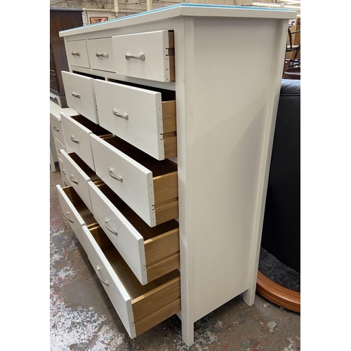 44 - A modern white painted oak chest of drawers - approx. 128cm high x 128cm wide x 43cm deep