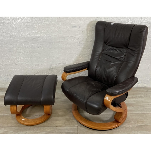 49 - A Himolla brown leather and bentwood swivel reclining armchair and footstool