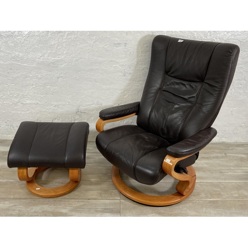 49 - A Himolla brown leather and bentwood swivel reclining armchair and footstool