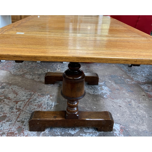 54 - A 1930s E. Gomme oak draw leaf dining table on baluster supports - approx. 74cm high x 92cm wide x 9... 