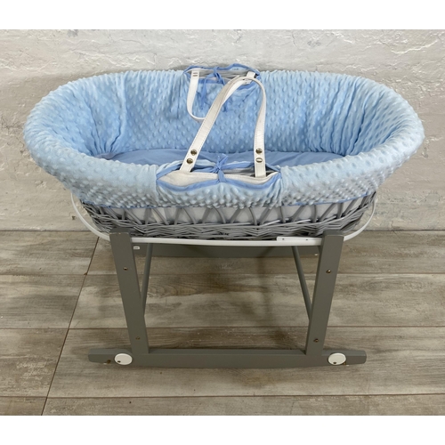 55 - Two baby items, one Cuddles Collection Ltd. grey painted wicker Moses basket on rocking stand and on... 