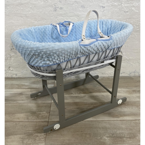 55 - Two baby items, one Cuddles Collection Ltd. grey painted wicker Moses basket on rocking stand and on... 