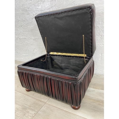 57 - An oxblood leather storage footstool - approx. 44cm high x 56cm wide x 42cm deep