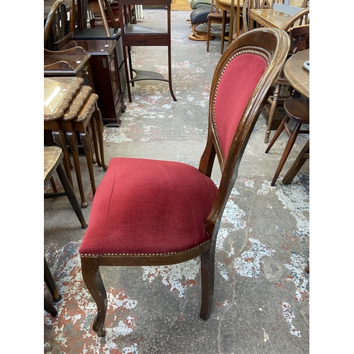 58 - An Italian style inlaid walnut effect circular pedestal dining table and four chairs