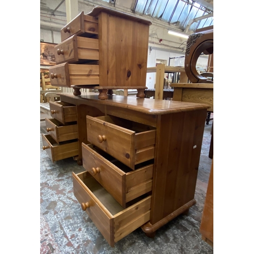 104 - Two pieces of pine bedroom furniture, one dressing table and one bedside chest of drawers