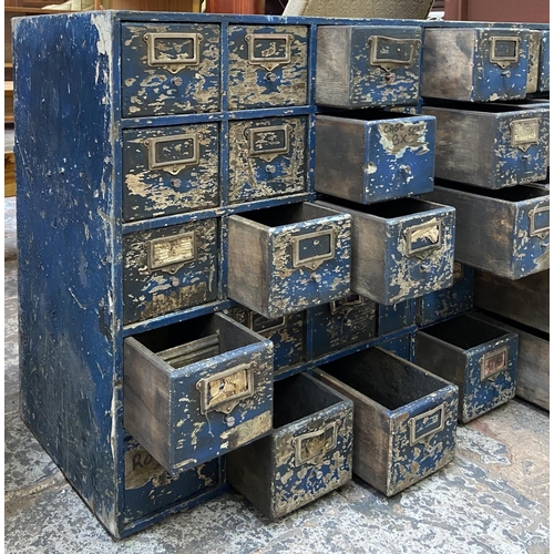 108 - A mid 20th century industrial blue painted wooden bank of drawers - approx. 60cm high x 94cm wide x ... 