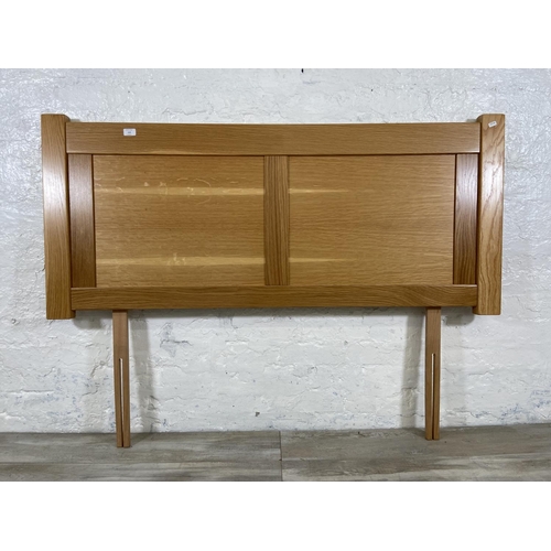 112 - A modern oak double bed headboard - approx. 150cm wide