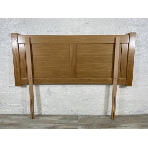 112 - A modern oak double bed headboard - approx. 150cm wide