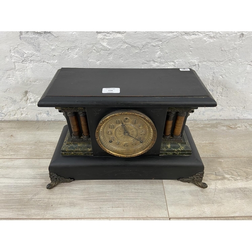 116 - A 19th century ebonised eight day mantel clock on cast metal supports - approx. 29cm high x 45cm wid... 