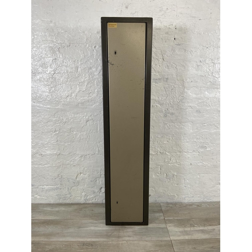 120 - A metal gun cabinet - approx. 132cm high x 29cm wide x 24cm deep (key in office)