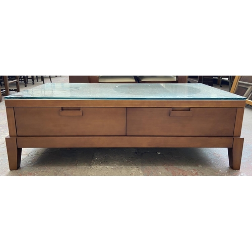 139 - A modern cherrywood rectangular two drawer coffee table - approx. 43cm high x 68cm wide x 132cm long