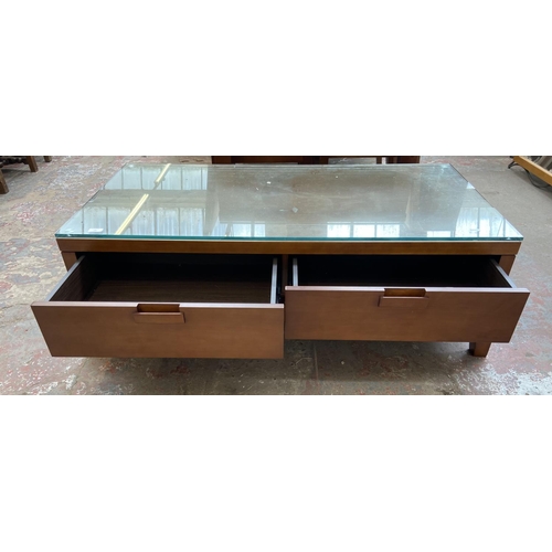 139 - A modern cherrywood rectangular two drawer coffee table - approx. 43cm high x 68cm wide x 132cm long