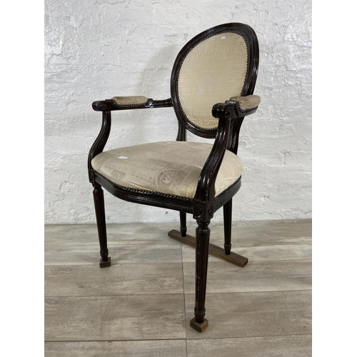 145 - A French Louis XVI style stained hardwood and fabric upholstered open armchair