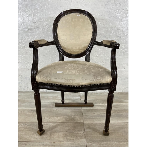 145 - A French Louis XVI style stained hardwood and fabric upholstered open armchair